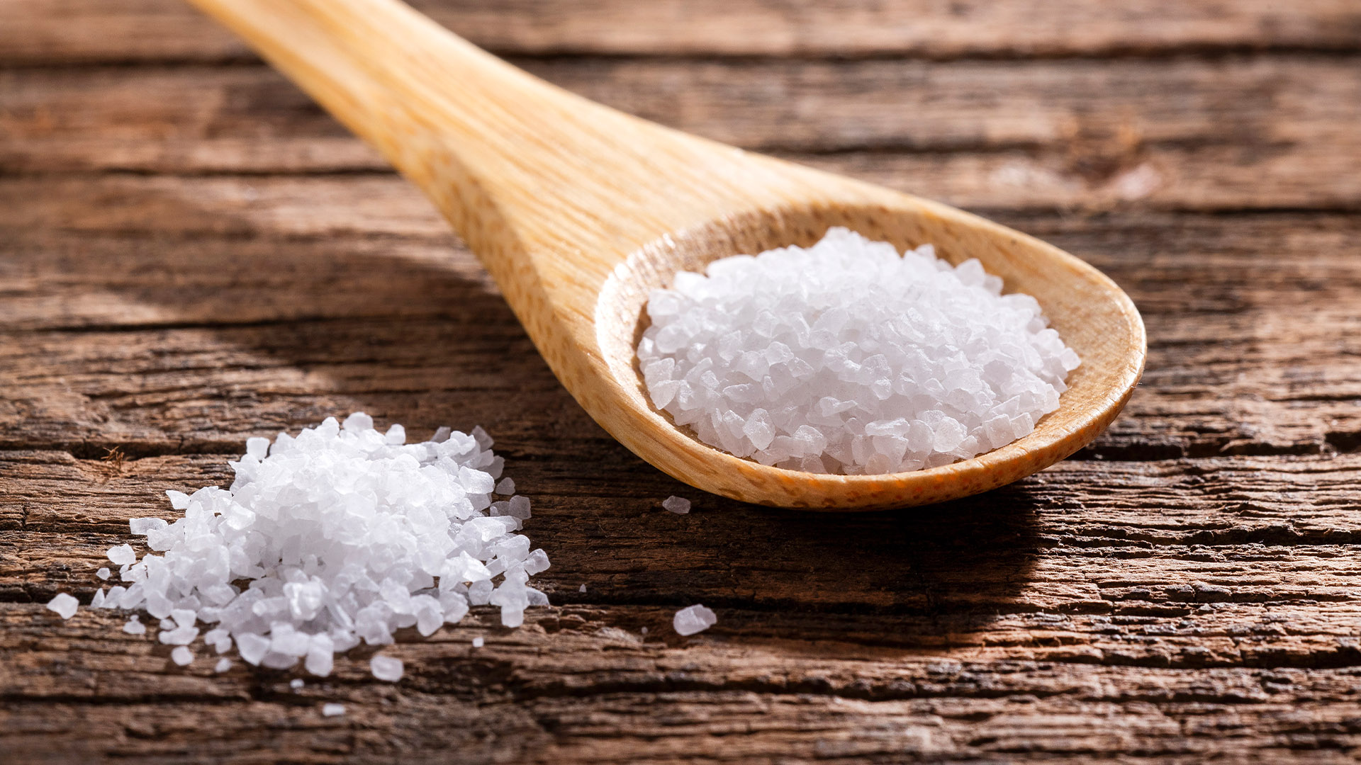 Salt on a wooden spoon.